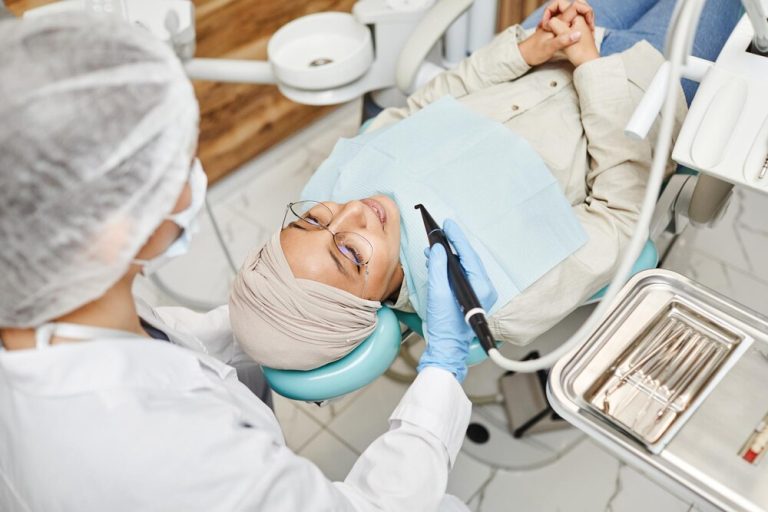smiling-woman-dentists-chair_236854-37839.jpg